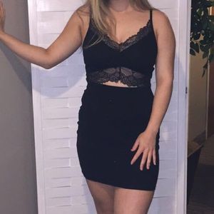 Black lacy body con dress with cut out